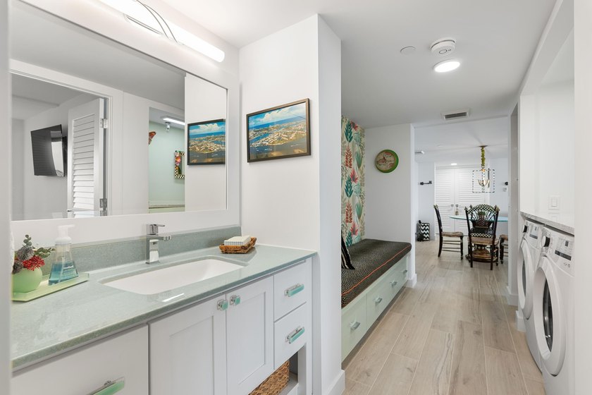 Experience elevated coastal living in this immaculate, fully - photo 39