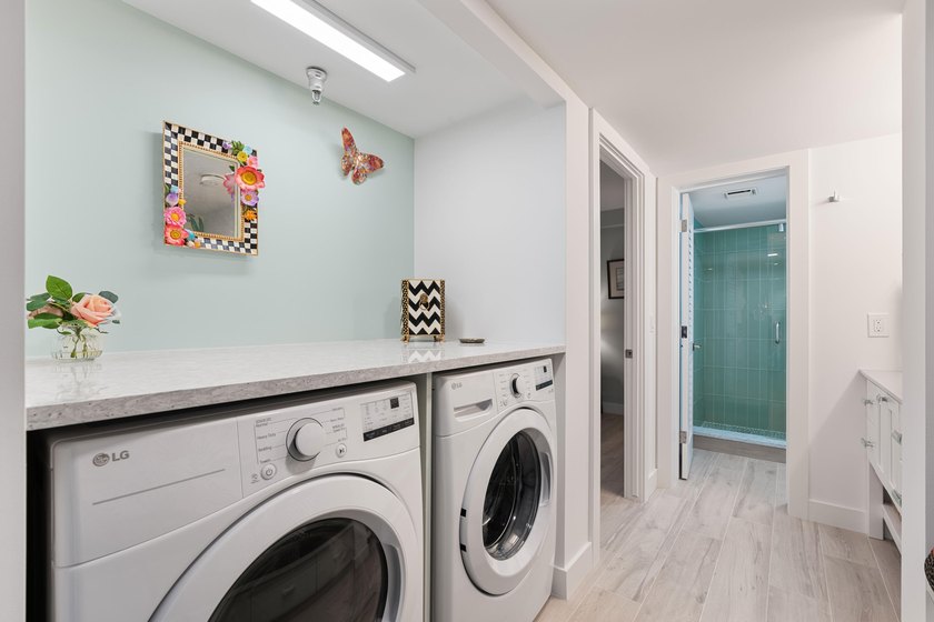 Experience elevated coastal living in this immaculate, fully - photo 40