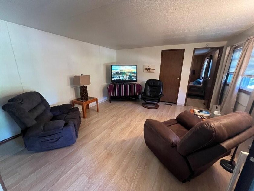 Affordable and move-in ready, this well-maintained 2-bedroom, 1 - photo 3
