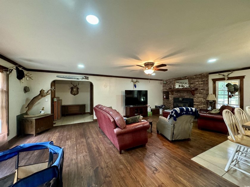 Lovely brick ranch-style home with just over 12 acres! Through - photo 6