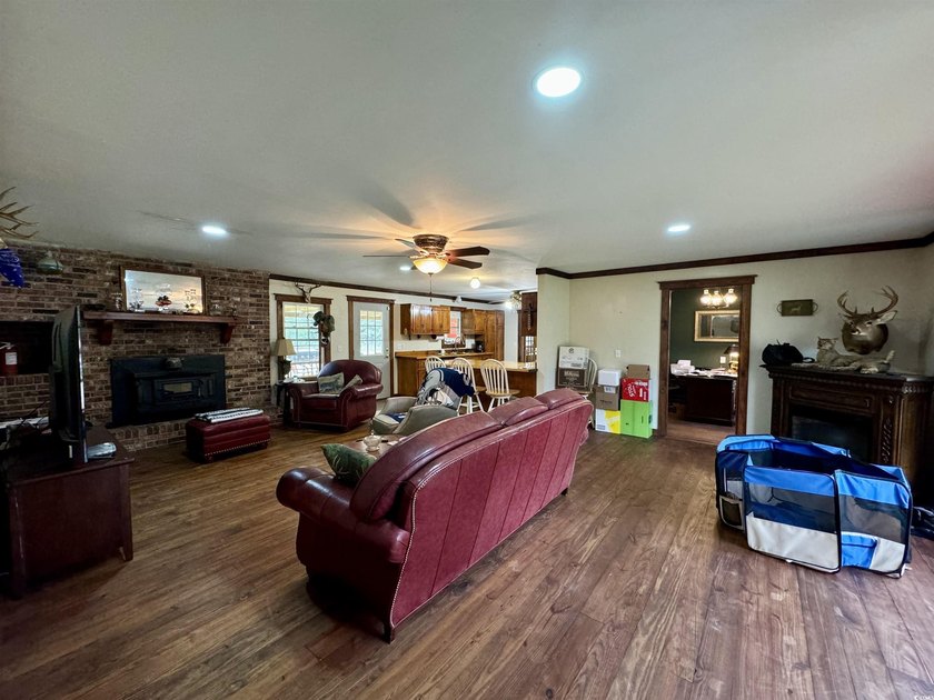 Lovely brick ranch-style home with just over 12 acres! Through - photo 8