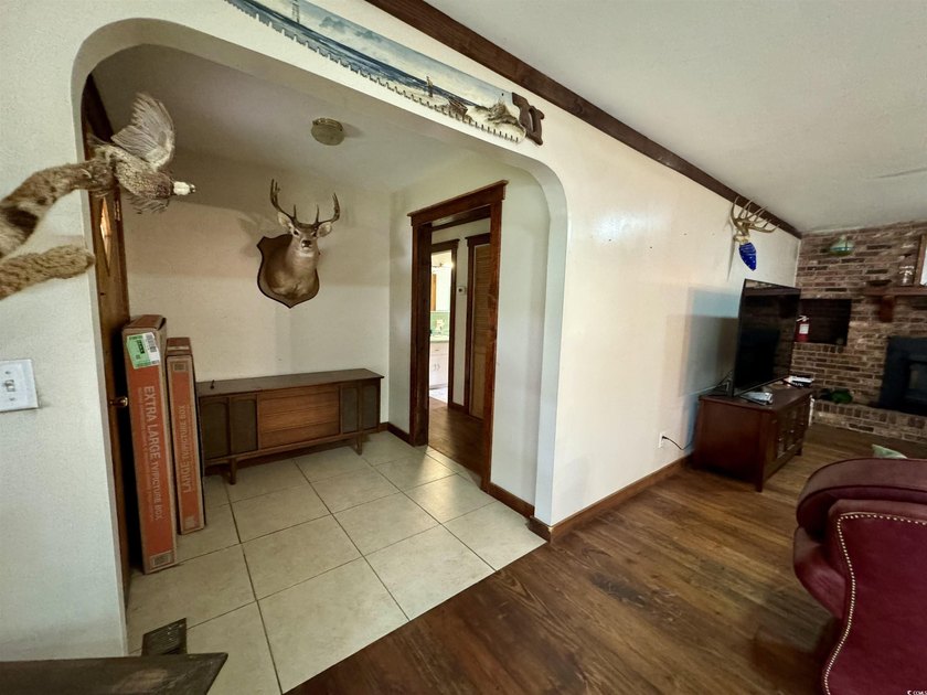 Lovely brick ranch-style home with just over 12 acres! Through - photo 9