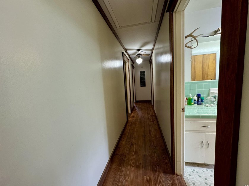 Lovely brick ranch-style home with just over 12 acres! Through - photo 10