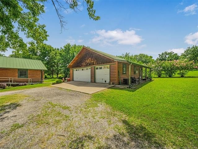 Nestled on just over 2 beautiful acres this custom-built log - photo 3