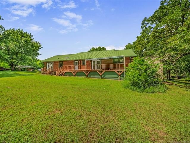 Nestled on just over 2 beautiful acres this custom-built log - photo 7