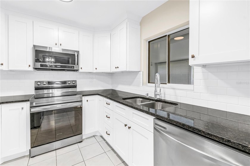 Welcome to Paradise says this charming ranch home in the Twin - photo 8