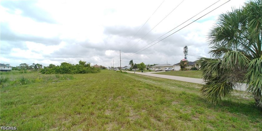 Cleared 80' X 125' canal front lot in an area of newer homes - photo 3