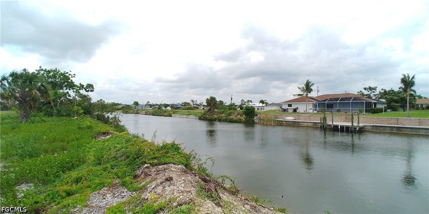Cleared 80' X 125' canal front lot in an area of newer homes - photo 4