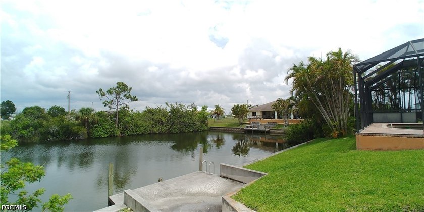 Cleared 80' X 125' canal front lot in an area of newer homes - photo 8