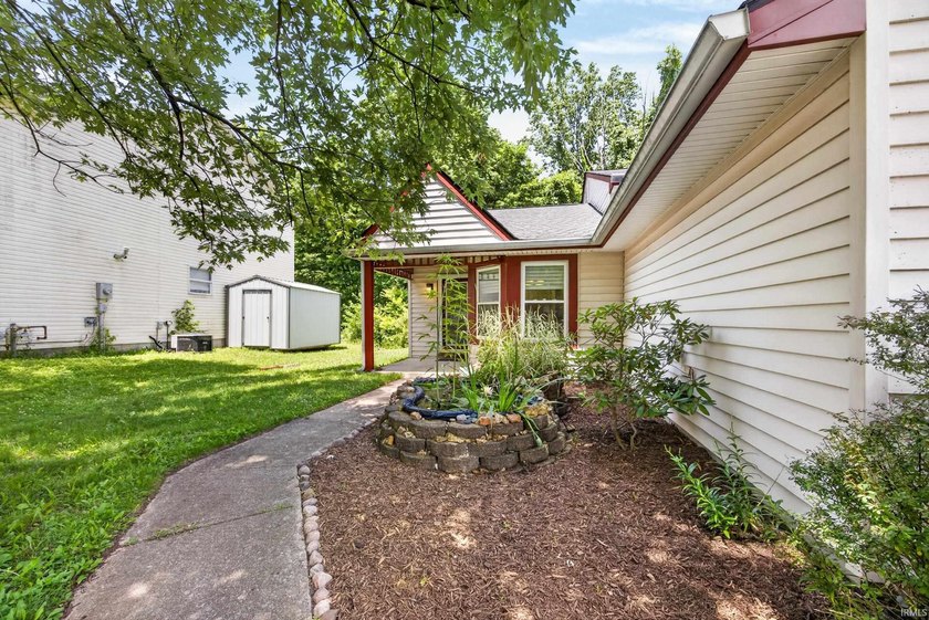 Tucked beneath mature trees on a quiet street, this charming 3 - photo 2