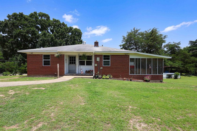 Classic brick home with room to spread out! Situated on - photo 2