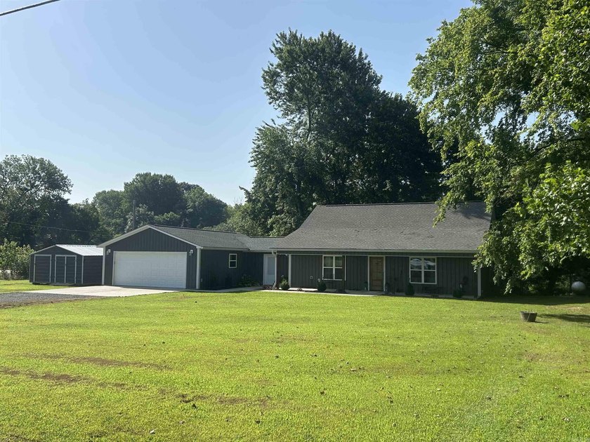 WOW! If you love fishing and riverfront living, this home is for - photo 2