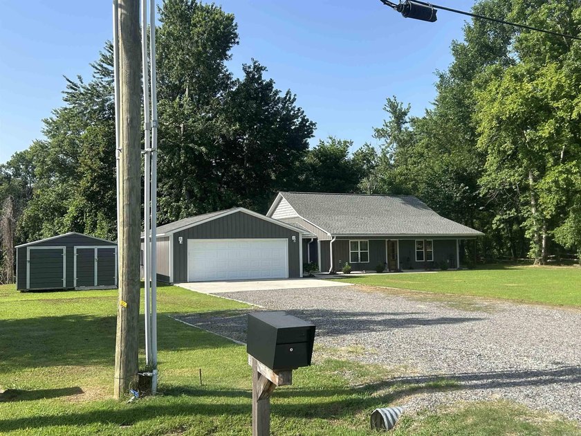 WOW! If you love fishing and riverfront living, this home is for - photo 3