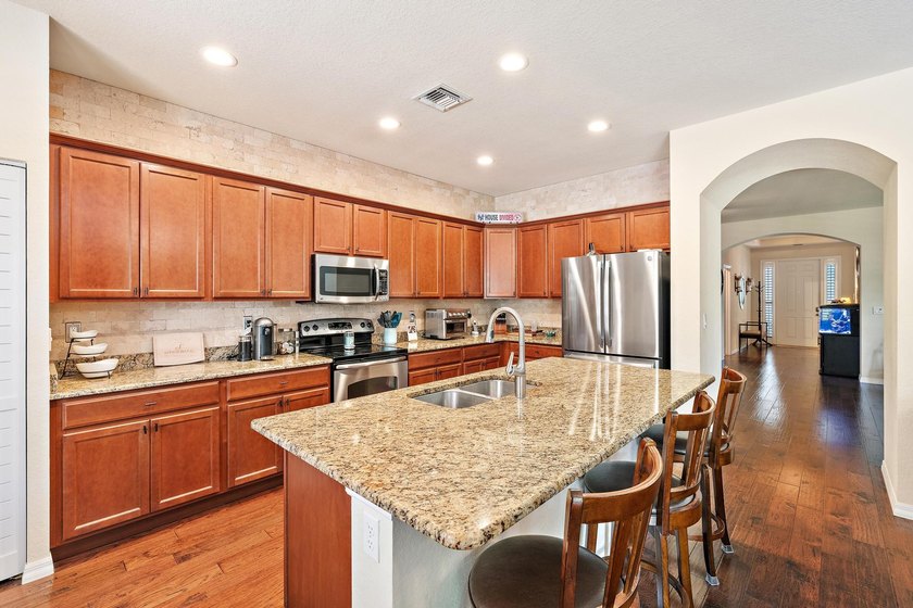Nestled within the prestigious gated community of Rialto, this - photo 4