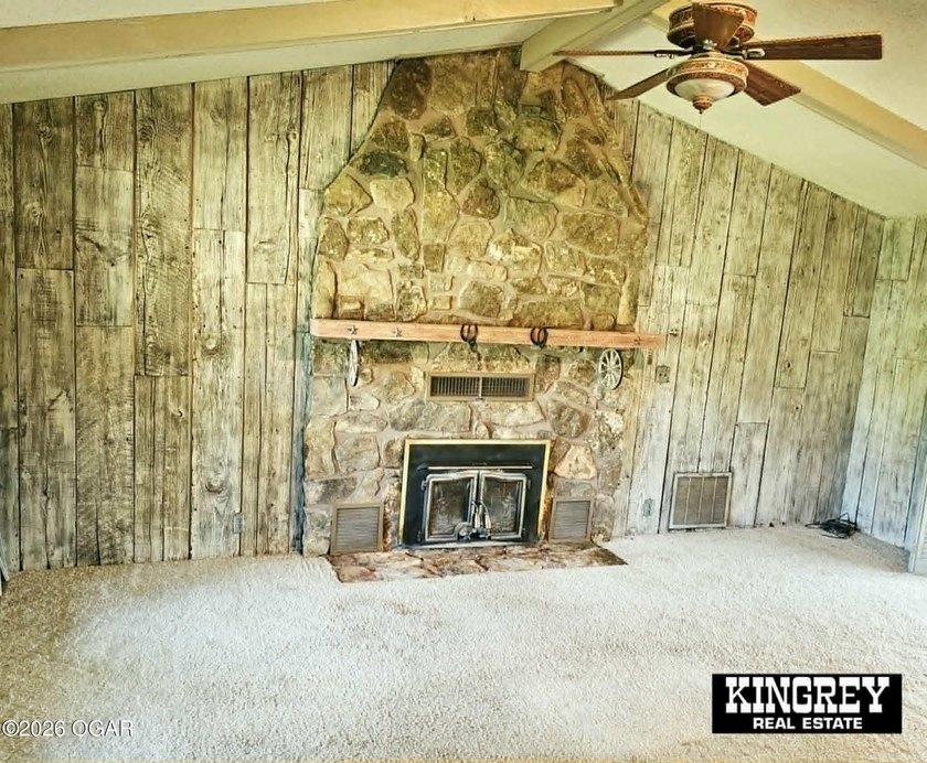 Rustic lodge-style living meets country convenience in this - photo 25