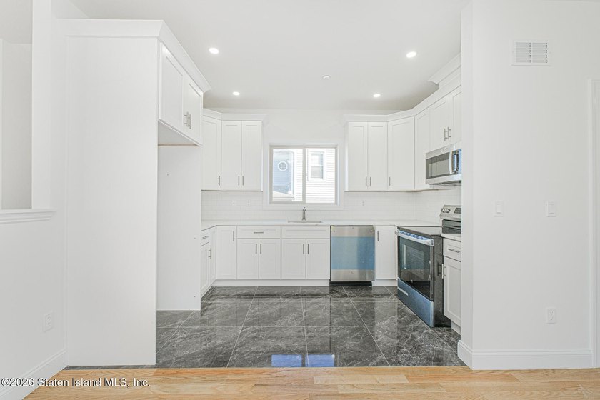 Brand-new 6 over 6 two-family home located in the desirable - photo 29