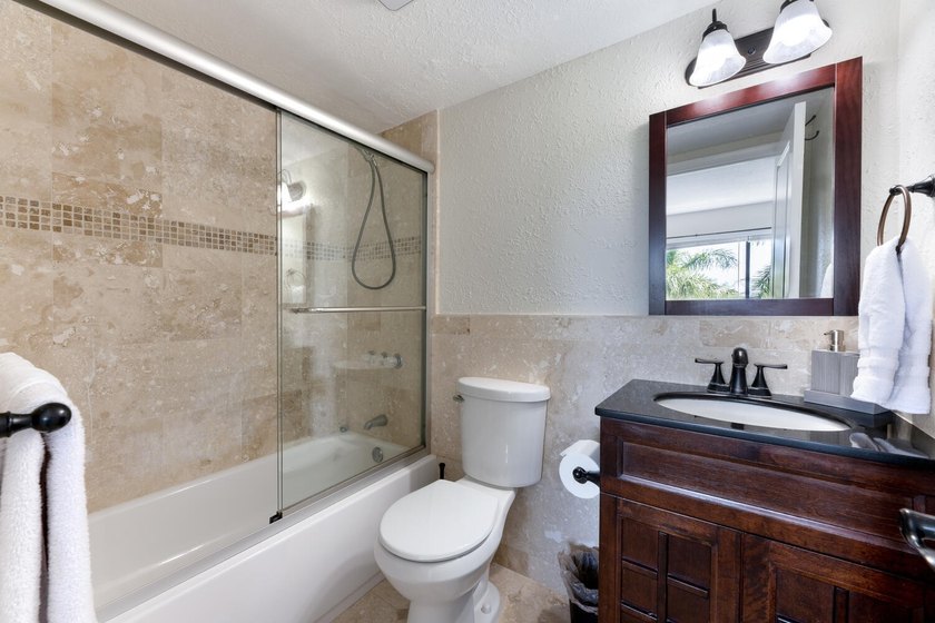 Beautiful furnished 2 bedroom 2 bath unit with open kitchen and - photo 9