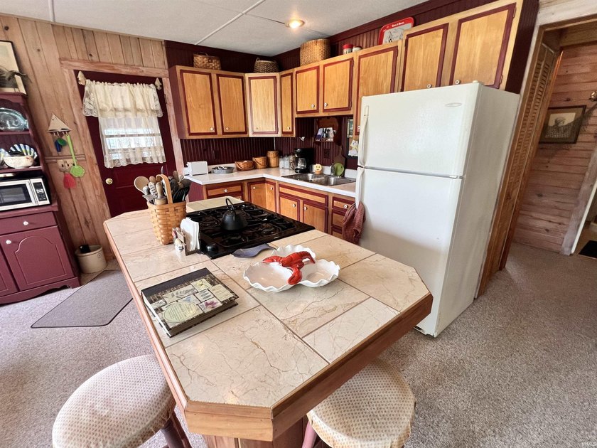 Welcome to lakefront living on beautiful Sechrist Lake! This - photo 3