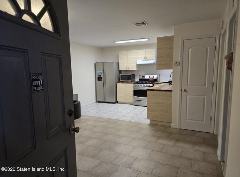 Welcome to this spacious and well-maintained two-family detached - photo 50