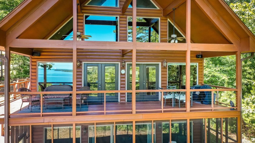 Come checkout this Furnished Lakefront Log cabin with stunning - photo 8