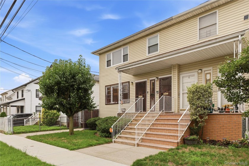 Welcome to this charming semi-attached two-family home offering - photo 3