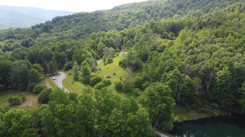 Stunning 5.30 acre lot with a large pond for fishing, floating - photo 4