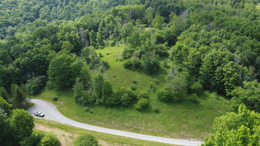 Stunning 5.30 acre lot with a large pond for fishing, floating - photo 8