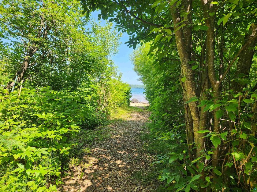 Set on approximately 220 feet of sandy Lake Superior shoreline - photo 3