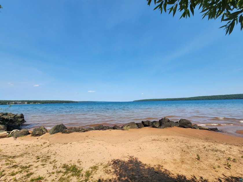 Set on approximately 220 feet of sandy Lake Superior shoreline - photo 7