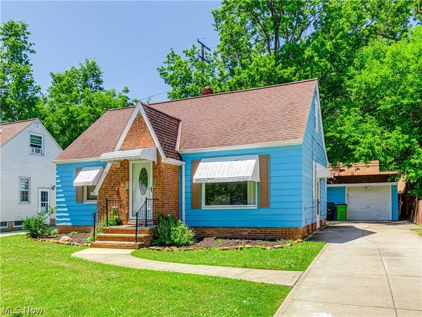 This 3-bedroom, 2-bath bungalow offers a bright, open feel with - photo 2