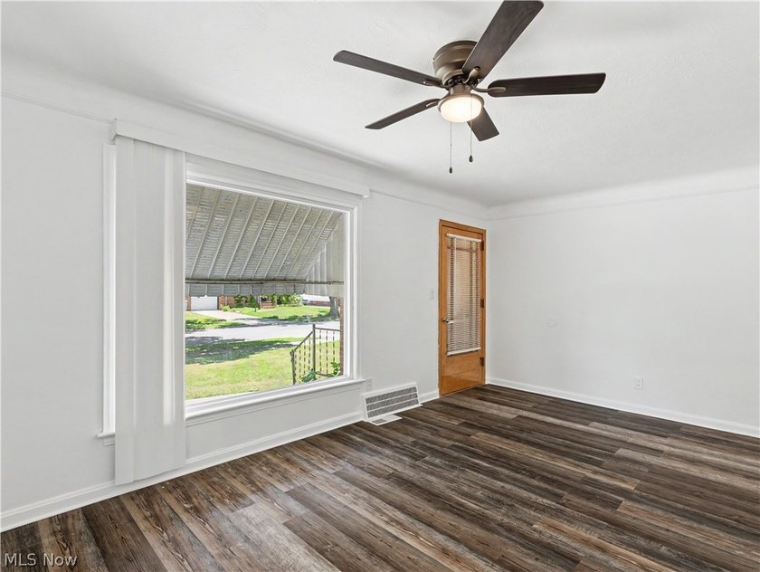 This 3-bedroom, 2-bath bungalow offers a bright, open feel with - photo 5