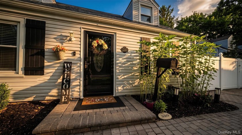 Welcome to this charming expanded home nestled on a quiet block - photo 2