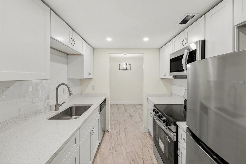 This 1 bedroom, 1 bathroom condo has been recently remodeled and - photo 3