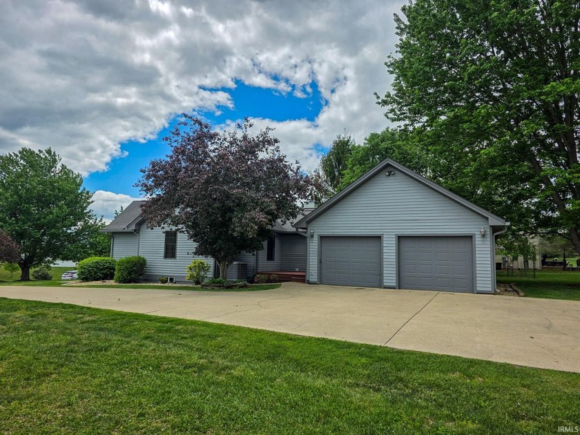 Situated on a picturesque 1.59-acre mostly level lot with a - photo 4