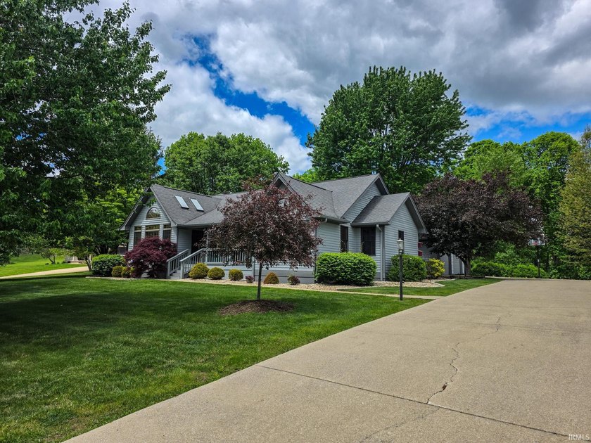 Situated on a picturesque 1.59-acre mostly level lot with a - photo 5