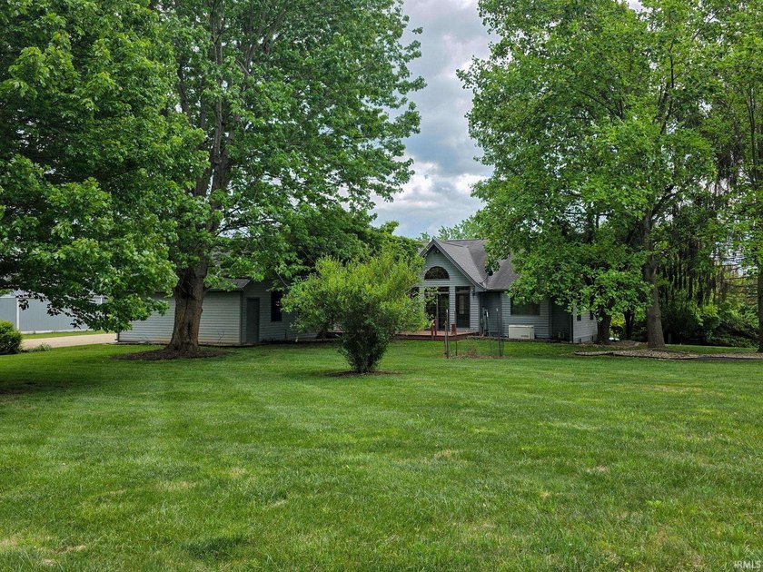 Situated on a picturesque 1.59-acre mostly level lot with a - photo 6