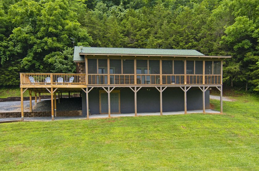 Welcome to this beautifully renovated log home tucked away in a - photo 2