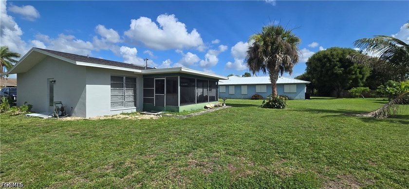 Thoughtfully positioned on a corner lot in SE Cape Coral, this - photo 5