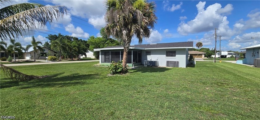 Thoughtfully positioned on a corner lot in SE Cape Coral, this - photo 6