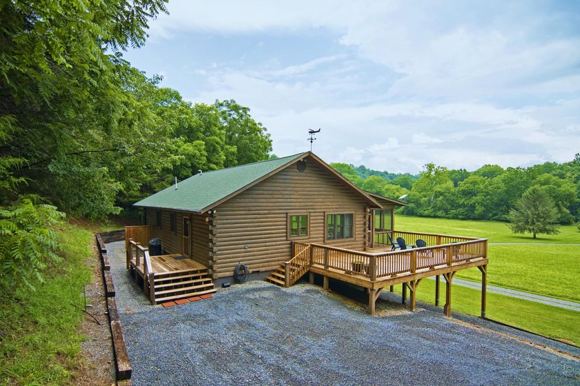 Welcome to this beautifully renovated log home tucked away in a - photo 6