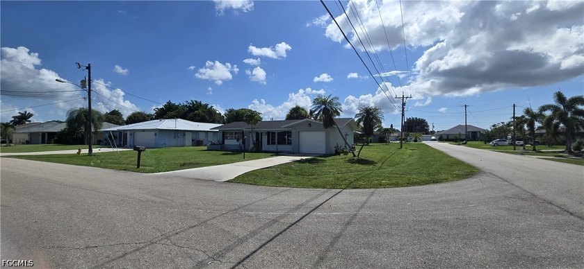 Thoughtfully positioned on a corner lot in SE Cape Coral, this - photo 7