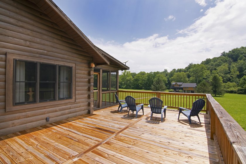 Welcome to this beautifully renovated log home tucked away in a - photo 7