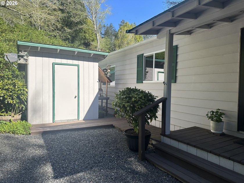 This well-maintained manufactured home is tucked in the hills - photo 22
