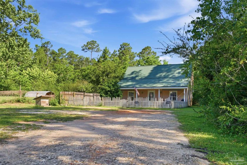 This 5.87-acre LDR-zoned property offers a quiet country setting - photo 33