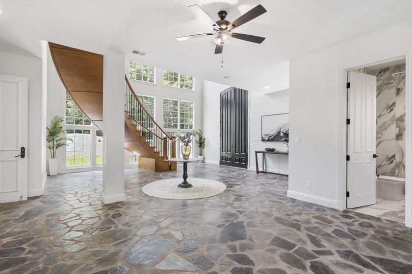 Located on approximately 1.5 gated lakefront acres just off - photo 8