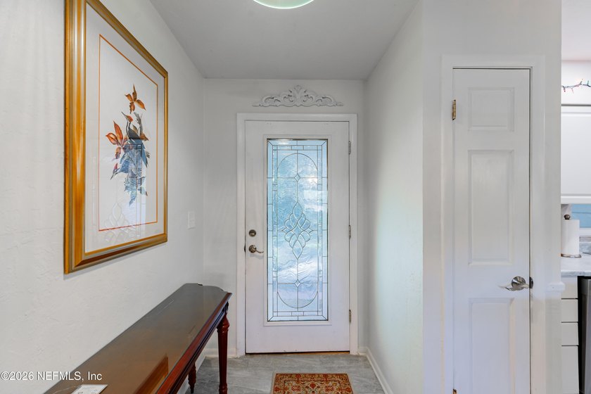 Wake up to peaceful lake views in this beautifully updated - photo 7