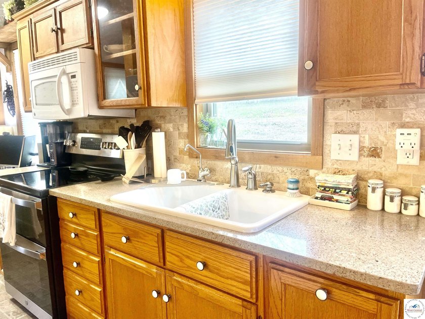 Enjoy peaceful lake living in this bright and beautiful home - photo 29