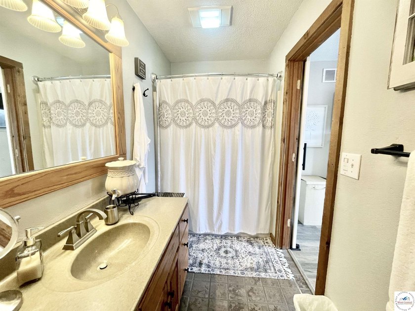 Enjoy peaceful lake living in this bright and beautiful home - photo 35