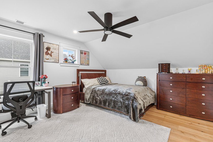 This home features a spacious first-floor primary suite with a - photo 22