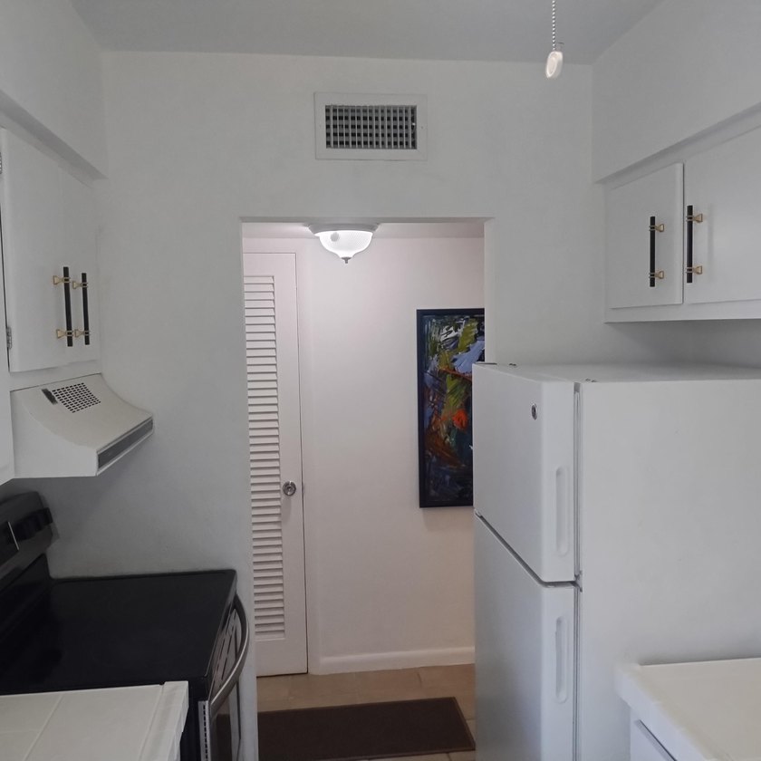 Welcome to this charming two-bedroom, two-bathroom condominium - photo 6